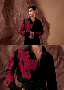 Close-up of HORD Bruised shirt showing dense crimson looped embroidery on black