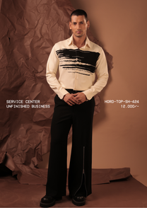 Man wearing HORD Unfinished Business cream shirt with black dry-brush stroke print, full-length studio shot