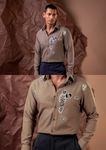 Close-up of HORD Almost shirt showing monochrome embroidered motifs on greige