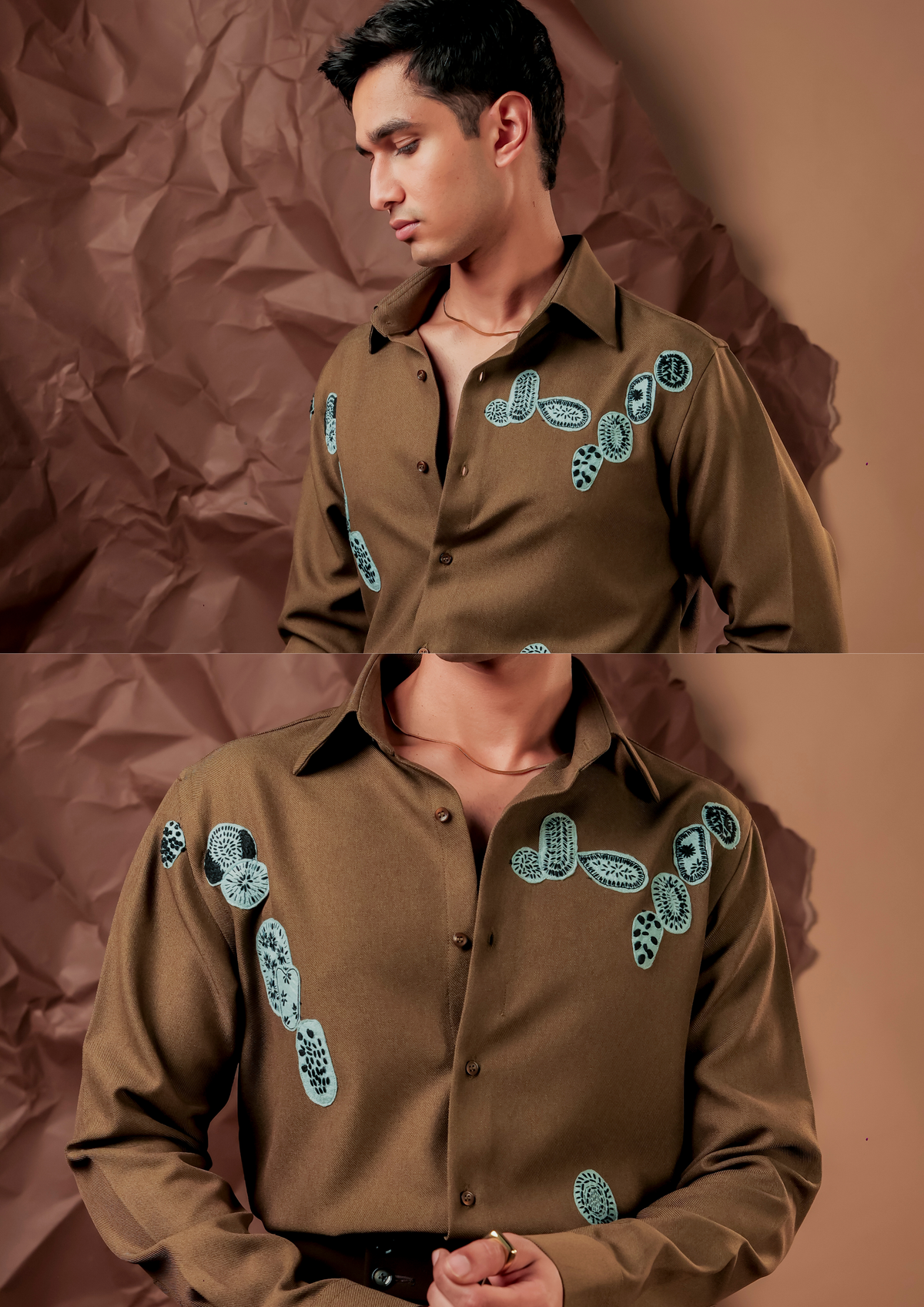 Close-up of HORD Somehow shirt showing aqua and black embroidered motifs on olive brown