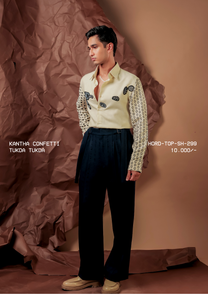 Man wearing HORD Tukda Tukda cream shirt with printed sleeves and kantha patches, full-length studio shot