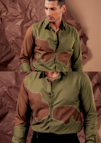 Close-up of HORD Olive The Above shirt showing brown panels edged with white bead stitching on olive