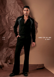 Man wearing HORD 1/7 black shirt with ivory zigzag embroidered lines, full-length studio shot