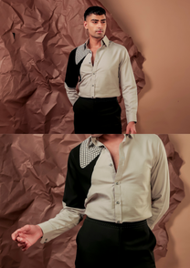 Detail of HORD Pattern Control Council shirt showing black sleeve panel meeting sage body and grid-check yoke