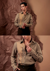 Close-up of HORD Chewing Gum shirt showing stretched drip panel with black outline on khaki