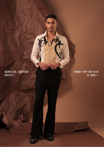 Man wearing HORD Decoit off-white and beige shirt with black calligraphic brush strokes, full-length studio shot