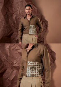 Close-up of HORD Gritty shirt showing hand-brushed grid paint texture on olive brown