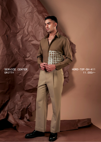 Man wearing HORD Gritty olive brown shirt with distressed off-white grid paint panel, styled with khaki trousers