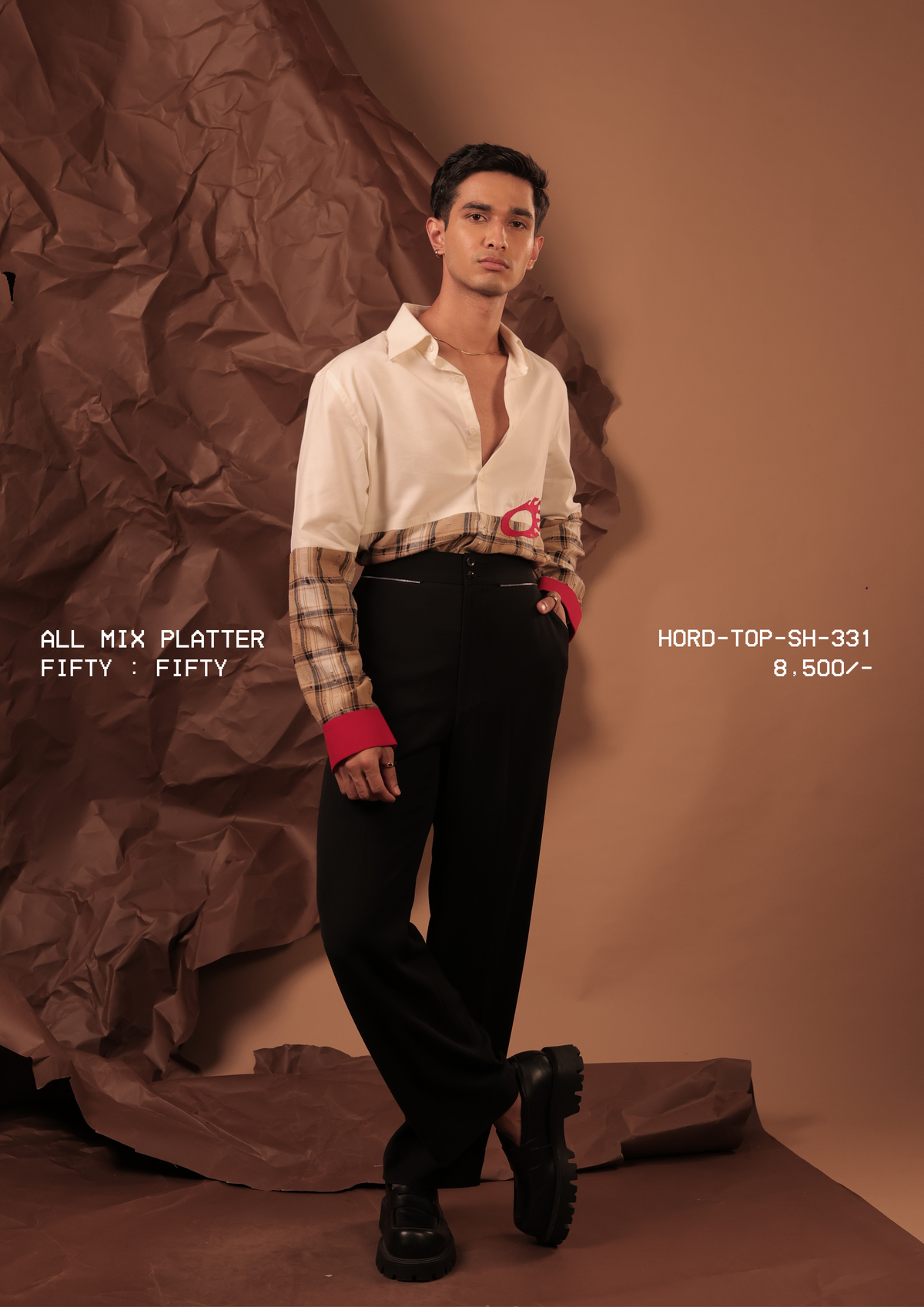 Man wearing HORD Fifty Fifty cream and tan plaid split shirt with red cuffs, full-length studio shot
