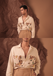 Man wearing HORD Strategic Nonsense ivory shirt with colorful button appliques, full body and detail collage