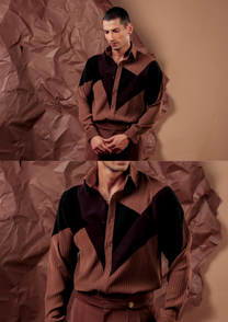 Close-up of HORD Fresh Pan shirt showing black chevron panels converging on brown pinstripe