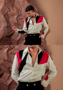 Close-up of HORD Margherita shirt showing red and black angular shoulder panels on cream pinstripe