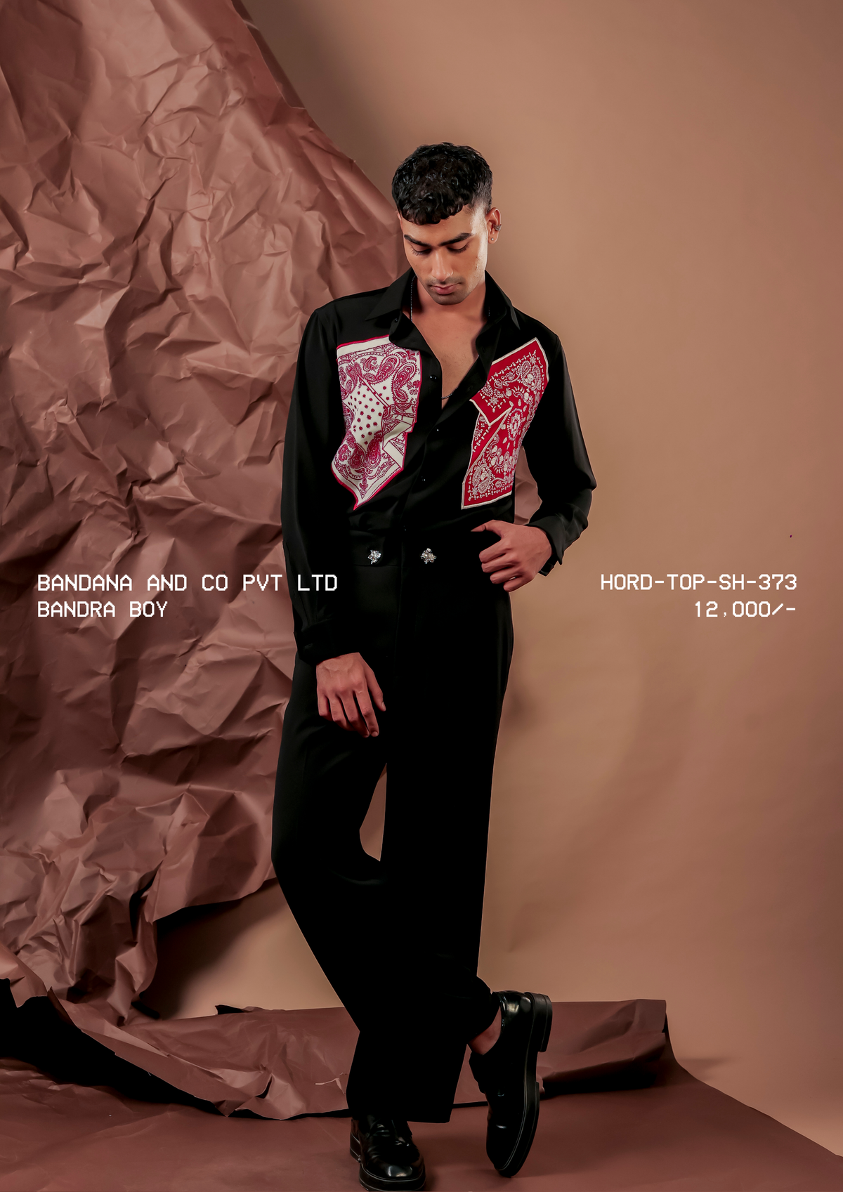 Man wearing HORD Bandra Boy black shirt with twin red and ivory bandana chest panels, full-length studio shot