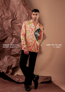 Man wearing HORD Export Quality coral paisley print shirt with black fan embroidered chest panel, full-length studio shot