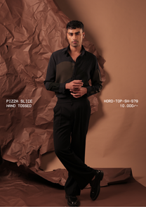 Man wearing HORD Hand Tossed black pinstripe shirt with curved olive front panel, full-length studio shot