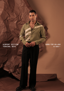 Man wearing HORD Terminal Boys sage olive shirt with stacked cream diagonal straps, full-length studio shot
