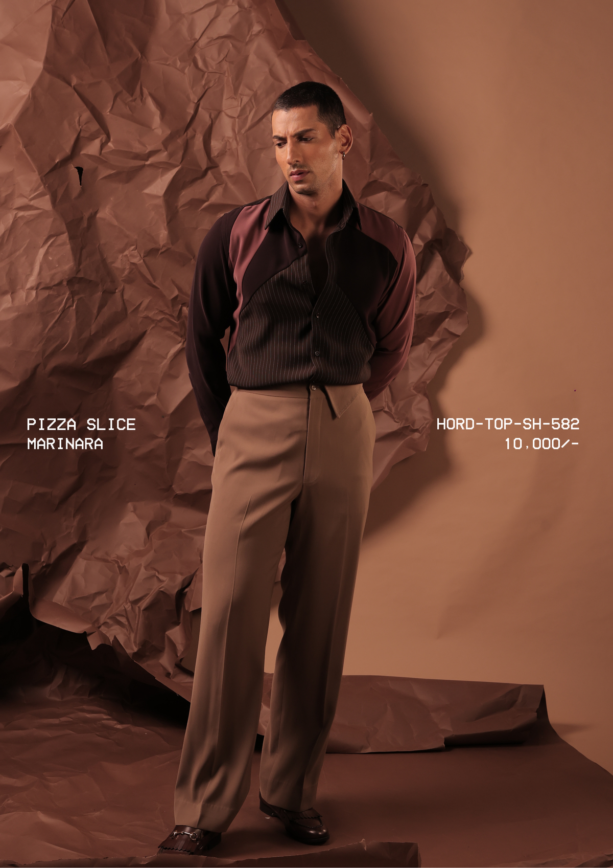 Man wearing HORD Marinara brown pinstripe shirt with dusty rose sleeves, styled with beige trousers