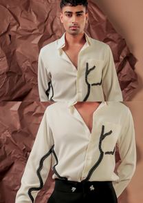 Man wearing HORD Short Circuit ivory shirt with black branching circuit print, full body and detail collage