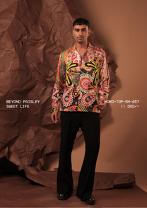 Man wearing HORD Sweet Life psychedelic paisley print shirt with yellow graphic script, full-length studio shot