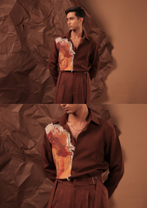 Close-up of HORD Work of Art shirt showing frayed painted canvas panel in orange and red on burgundy