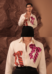 Close-up of HORD Tiecoon shirt showing striped rust and magenta bows on ivory